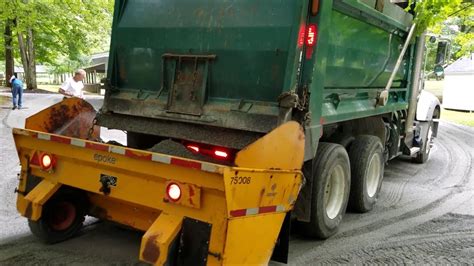 Spreading gravel with skid steer 